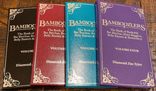 Four books titled 'Bamboozlers' on a wooden surface