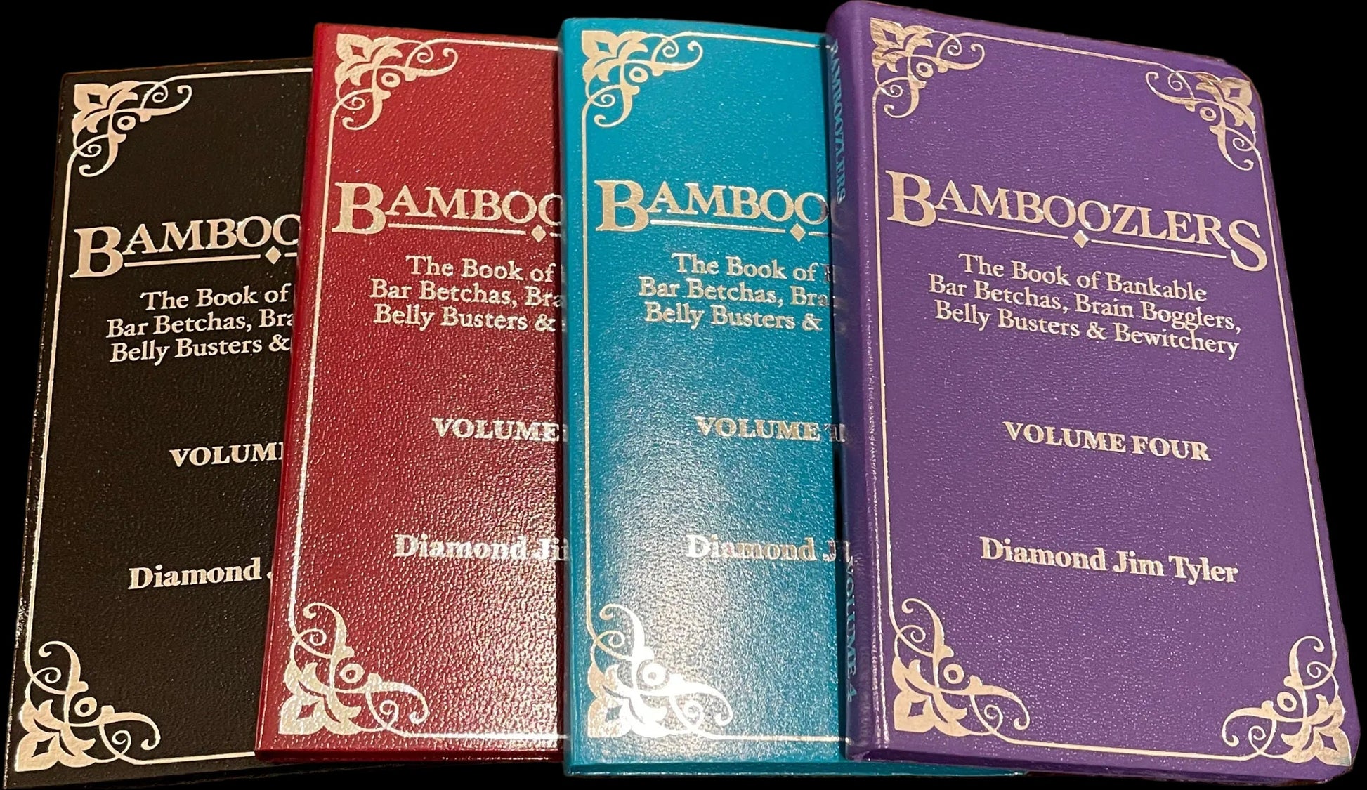 Four books titled 'Bamboozlers' on a wooden surface