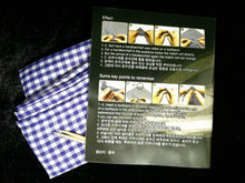 Blue and white checkered cloth with a black card featuring text and images on a dark background