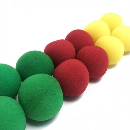 Colorful foam balls in red, green, and yellow on a white background