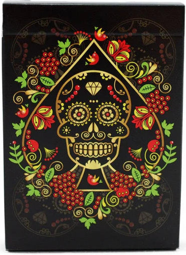 Playing card box with skull and floral design on a black background