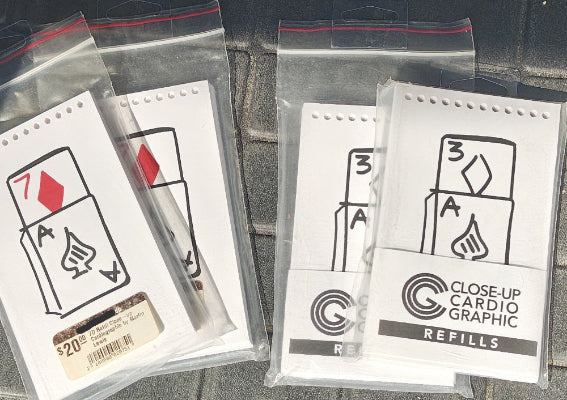 Close-up Cardio Graphic refills in clear packaging on a dark surface