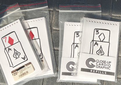 Close-up Cardio Graphic refills in clear packaging on a dark surface