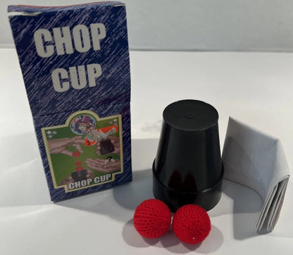 Black 'Chop Cup' with red balls and packaging on a white background