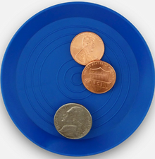 Blue round tray with coins on a white background