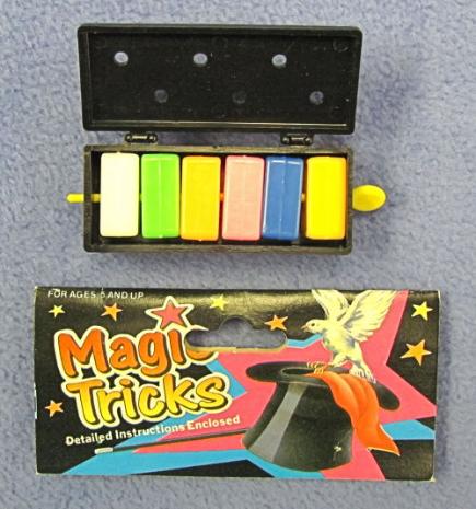 Set of colorful magic tricks with packaging on a gray background
