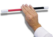 Hand holding a red, white, and black baton against a white background