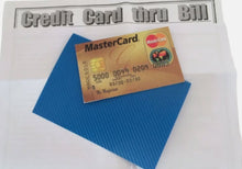 MasterCard credit card on a blue textured surface with a white background