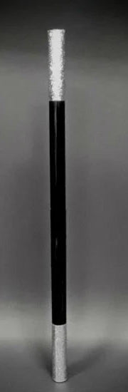 Black and silver cylindrical object on a gray background