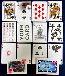 Set of playing cards with various suits and values displayed.