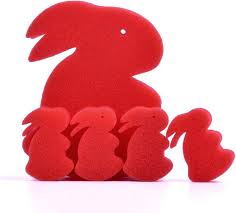 Set of red rabbit-shaped objects on a white background