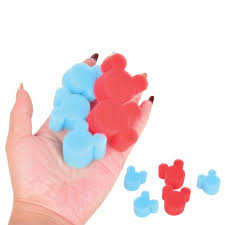 Colorful bear-shaped erasers on a hand with a white background