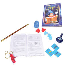 Fantasy magic book with pen, notebook, and various magic-themed items on a white background