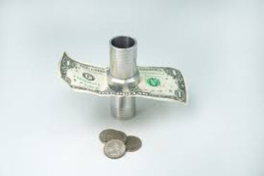 Metallic object with a dollar bill folded over it on a white background