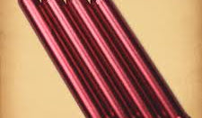 Set of red soldering iron tips on a beige background