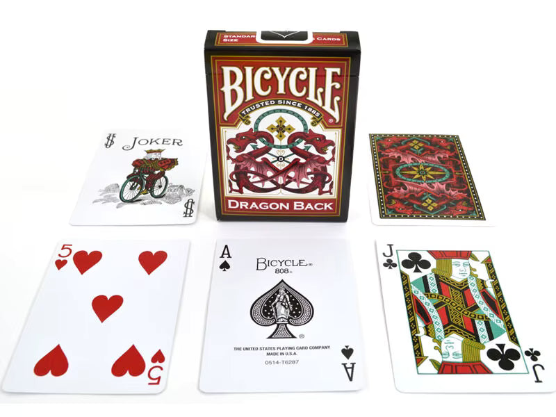 Bicycle playing cards with a dragon back design, including cards and box on a white background.