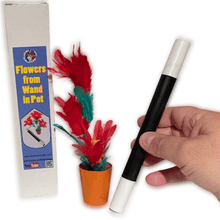 Magic wand with flowers and packaging on a white background