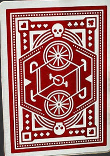 Red and white playing card with a central design and border