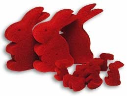 Red felt bunny shapes on a white background