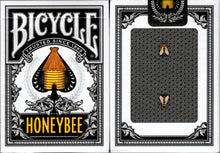 Bicycle Honeybee playing cards with black and gold design on a white background