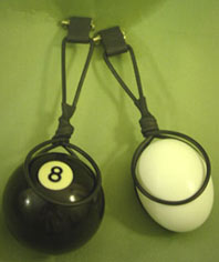 Black and white ball with number 8 on a green background