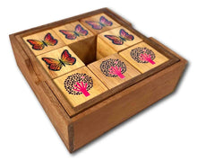 Wooden puzzle with butterfly and tree designs on a white background