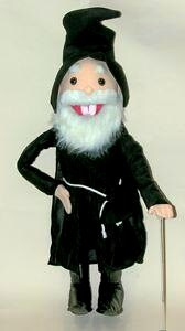 Plush toy resembling a character with a black outfit, white beard, and red mouth on a plain background