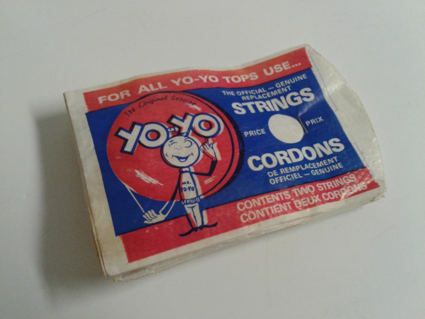 Box of YO-YO strings with a cartoon character on a white background