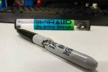 Two markers with 'Spiral' branding on a white background