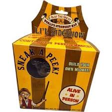 Yellow and brown box with text and graphics, featuring a person with a hat and cane.