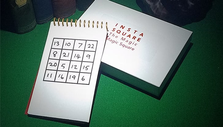 Two notebooks titled 'Insta Square' on a green surface