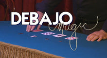 Close-up of a card trick with 'Debajo Magic' branding.