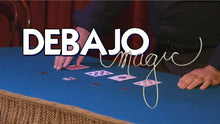 Close-up of a card trick with 'Debajo Magic' branding.
