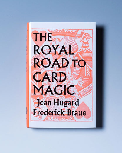 Book cover of 'The Royal Road to Card Magic' with decorative design on a light blue background