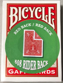 Bicycle playing card box with red and green design on a gray background