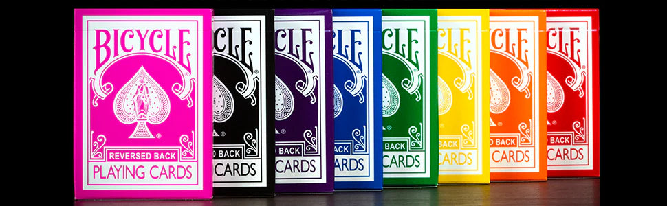 Set of eight Bicycle playing card boxes in different colors on a black background