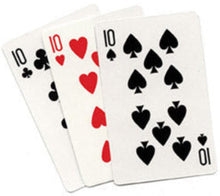 Three playing cards showing tens of clubs, hearts, and spades on a white background