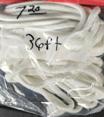 White soft magician rope in a clear plastic bag with measurements written on it.