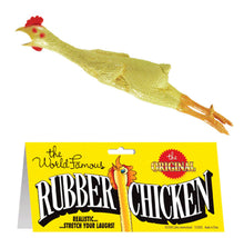 Rubber chicken toy with packaging on a pink background