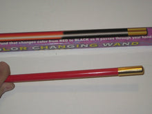 Color-changing wand with red to black transformation on a white background