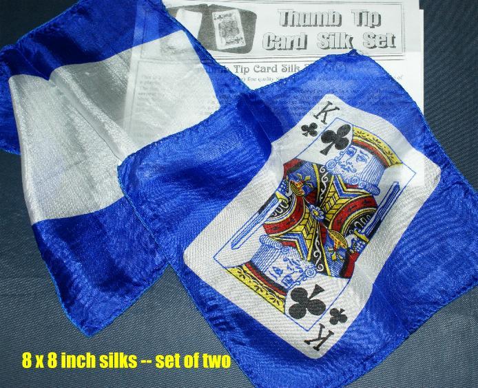 Blue and white silk with a playing card design, set against a dark background.