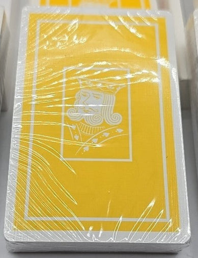 Four decks of playing cards in different colors on a white background