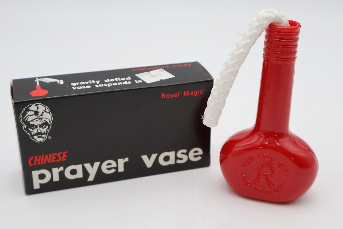 Red prayer vase with packaging on a white background