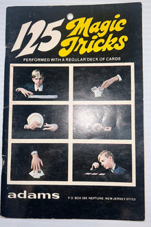 Vintage book cover of '125 Magic Tricks' by Adams with black and white images of card tricks.