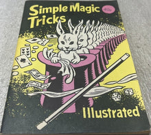 Book titled 'Simple Magic Tricks Illustrated' with a cat in a top hat and魔术棒 on a yellow background.