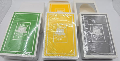 Four decks of playing cards in different colors on a white background