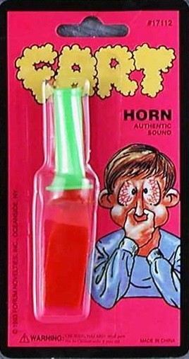 Fart horn on a pink packaging with cartoon illustration of a man and 'Fart' text.