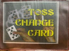 Playing cards with text 'TOSS CHANGE CARD' on a textured surface
