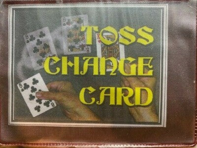 Playing cards with text 'TOSS CHANGE CARD' on a textured surface