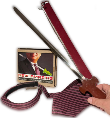 Sword being used to cut a necktie with a small box labeled 'New Amazing Sword Through Neck' in the background.